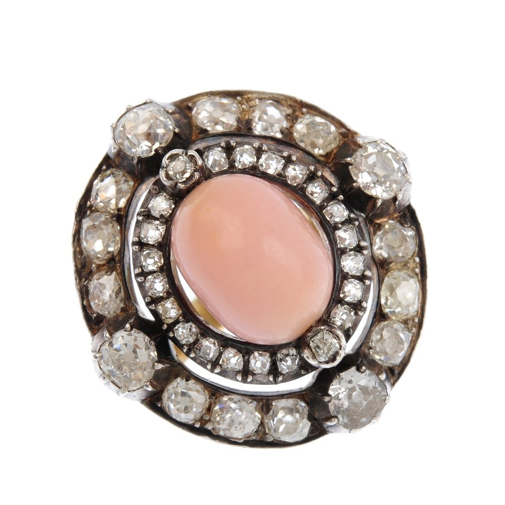 A conch pearl and diamond ring. The conch pearl, with (1 of 2)