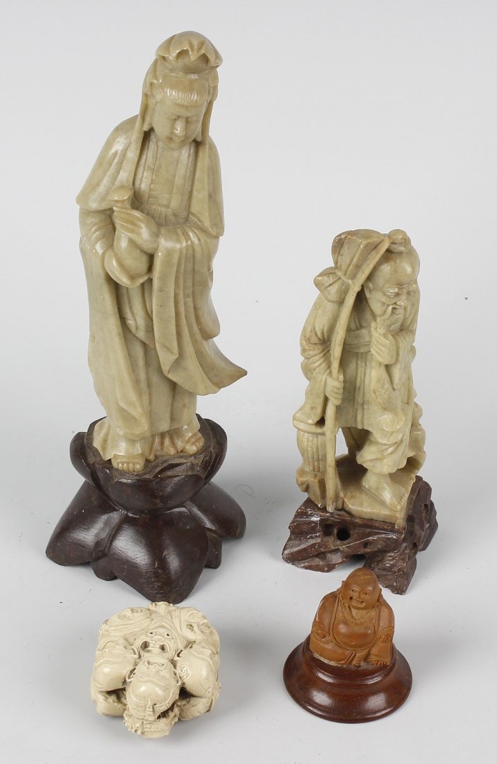 A group of Oriental cabinet items, comprising: two: A group of Oriental cabinet items, comprising: two soapstone figures, the larger carved as Kwanyin/Guanyin, Goddess of Mercy, 8, (20.5cm) high including stand; two hardstone seals, the smaller with te