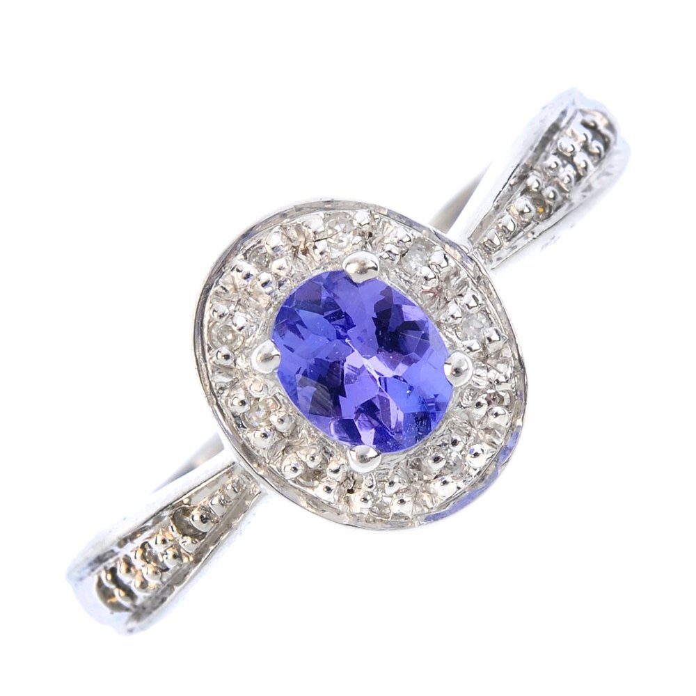 A 9ct gold tanzanite and diamond cluster ring. The (1 of 3)