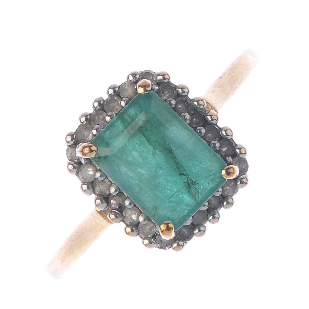 A 9ct gold emerald and diamond cluster ring. The (1 of 3)