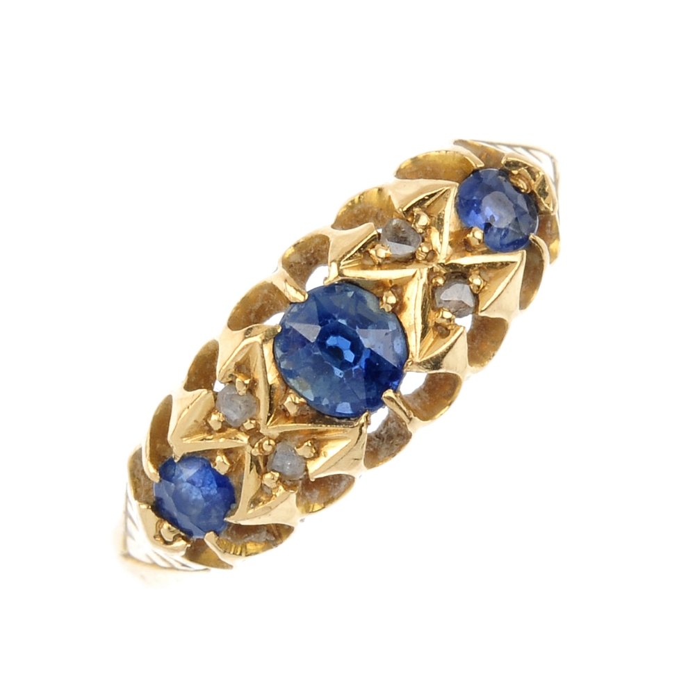 An Edwardian 18ct gold sapphire and diamond ring. The (1 of 3)