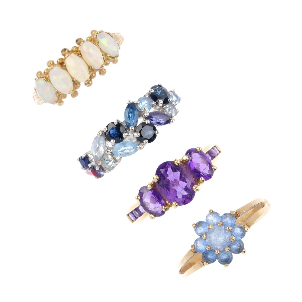 Four 9ct gold gem-set dress rings. To include an oval (1 of 2)