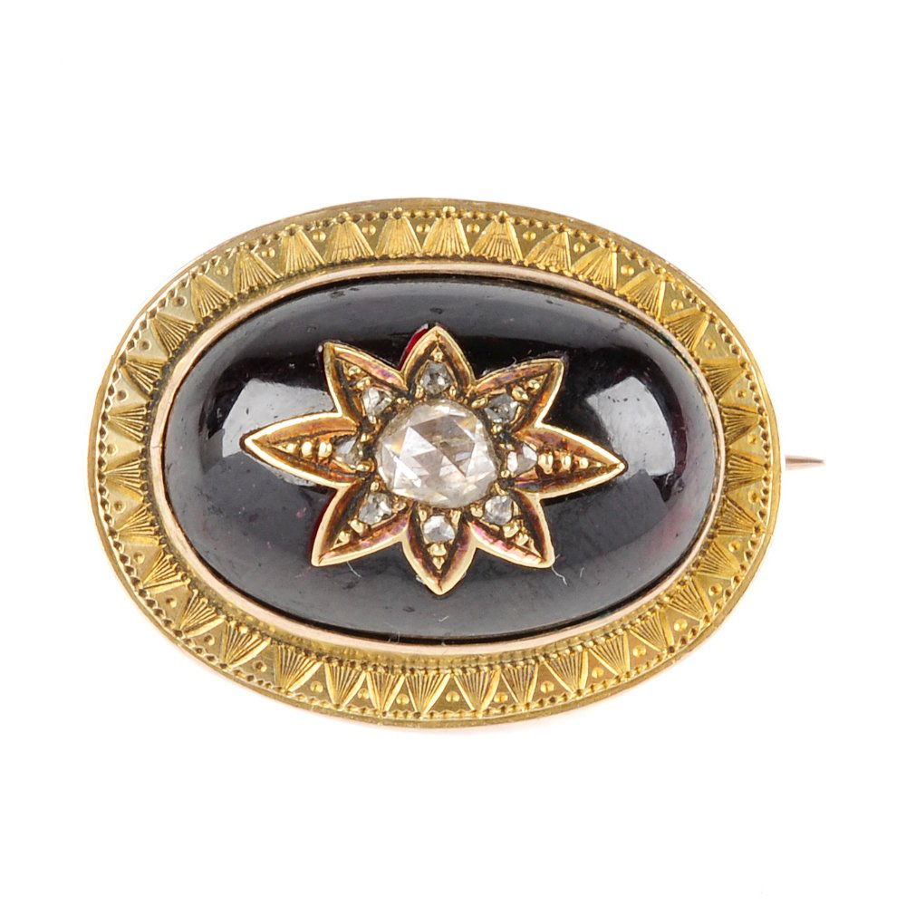 A late 19th century gold, garnet and diamond brooch. (1 of 2)