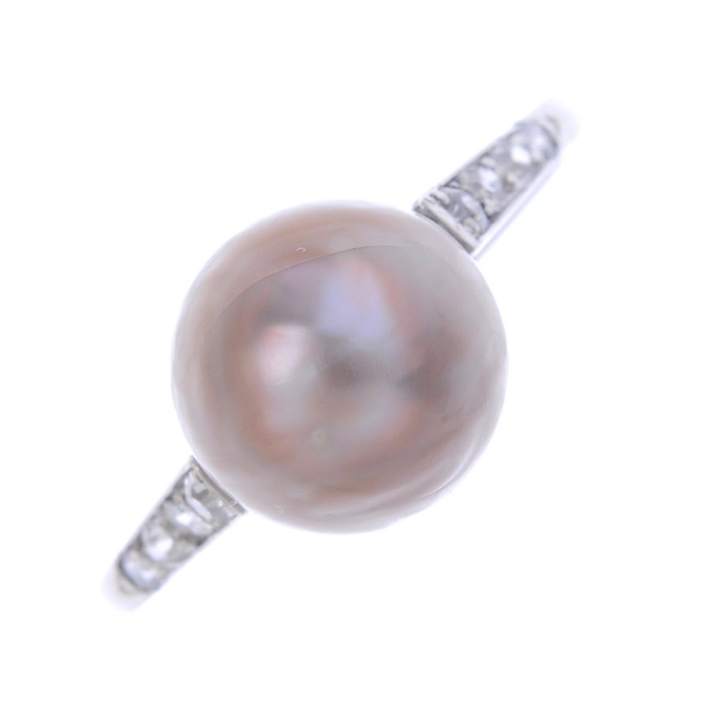 A natural pearl and diamond ring. The natural pearl, (1 of 3)
