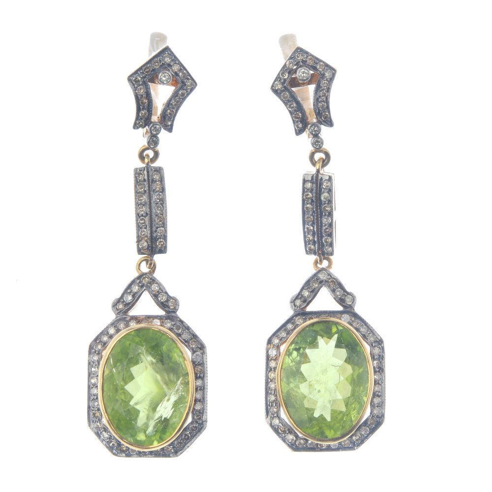 A pair of peridot and diamond earrings. Each designed (1 of 2)