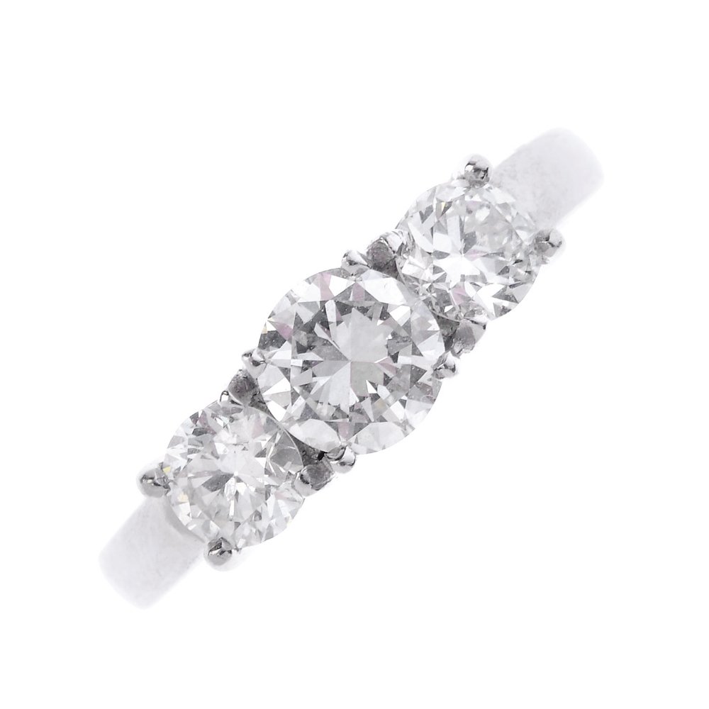 An 18ct gold diamond three-stone ring. The graduated (1 of 3)