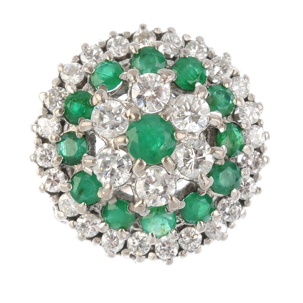 An 18ct gold diamond and emerald cluster ring. The (1 of 4)