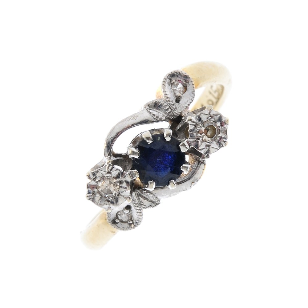 An 18ct gold sapphire and diamond crossover ring. (1 of 3)