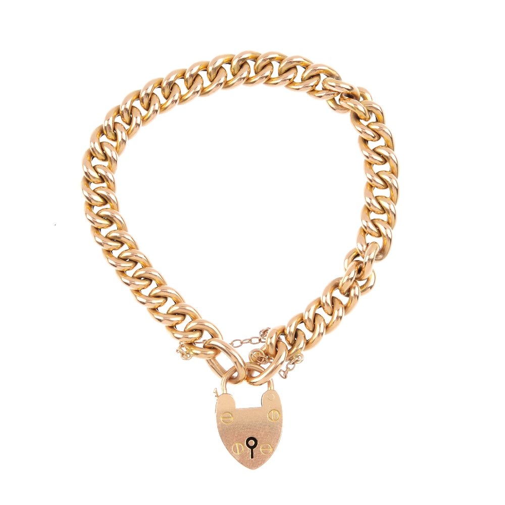 An early 20th century 15ct gold curb-link bracelet. The (1 of 2)