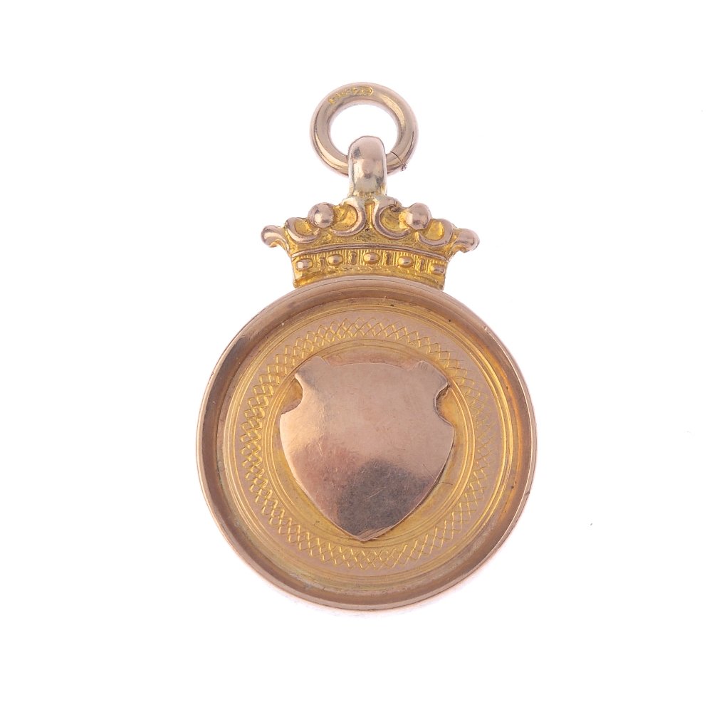 A 1920s 9ct gold T.T. Race medallion. The vacant shield (1 of 2)