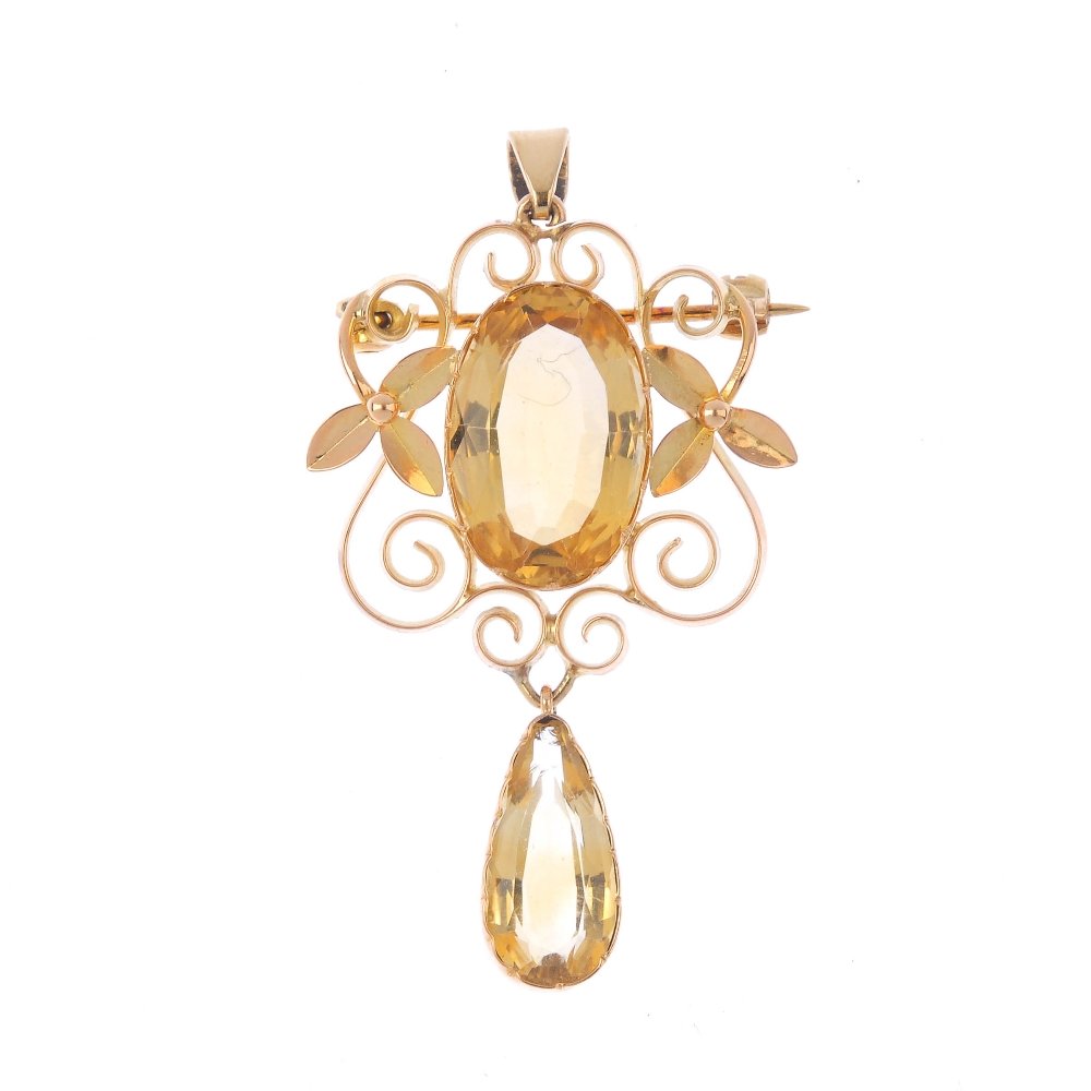 A citrine pendant. The oval-shape citrine, within an (1 of 2)