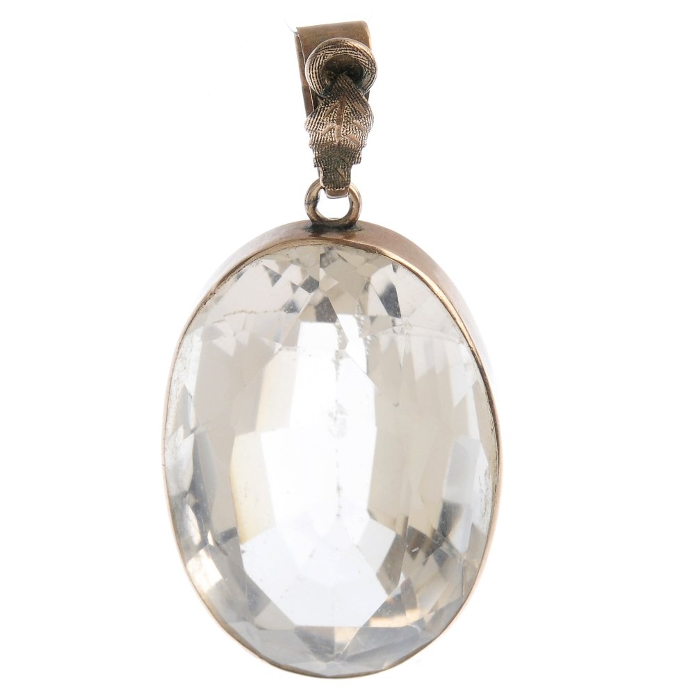 A citrine pendant. The oval-shape citrine, with (1 of 2)