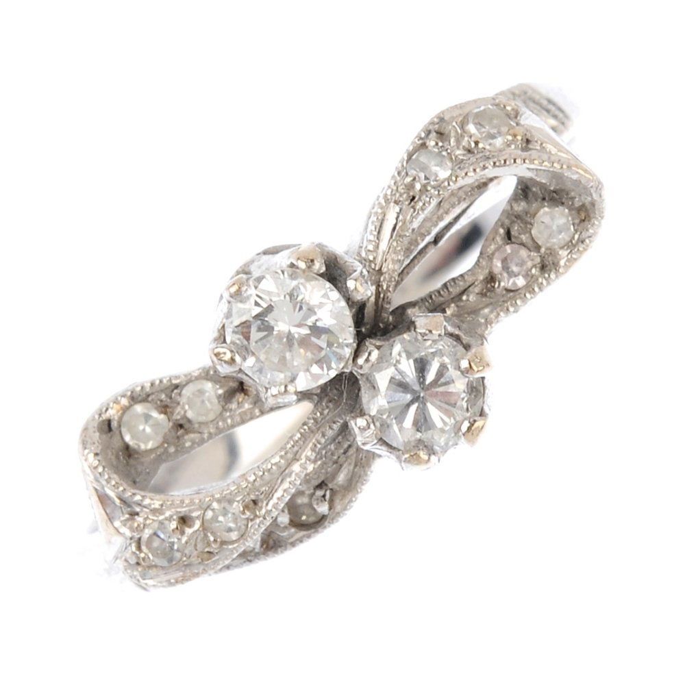 A diamond dress ring. Designed as a bow, the twin (1 of 3)