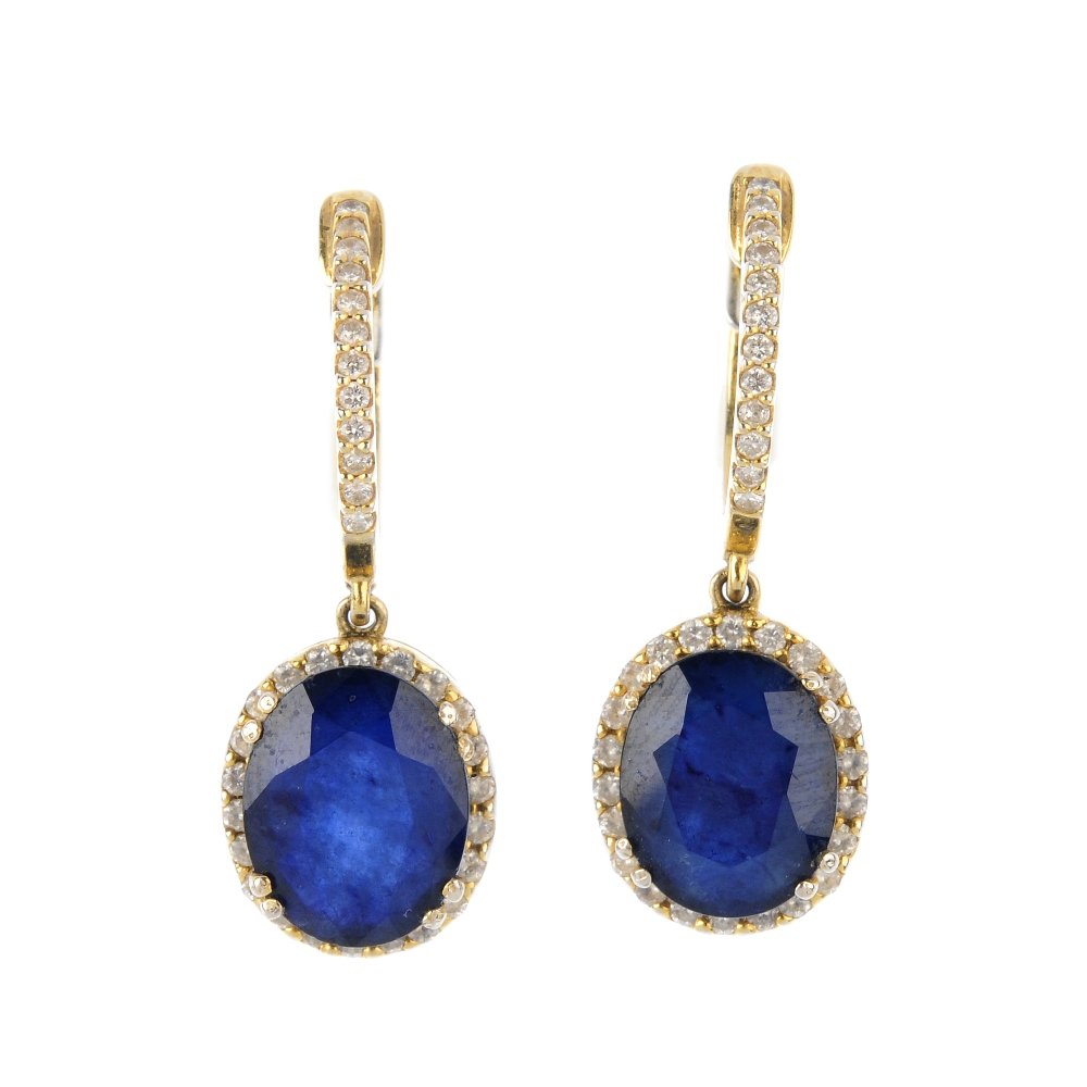 A pair of sapphire and diamond earrings. Each designed: A pair of sapphire and diamond earrings. Each designed as an oval-shape sapphire, with brilliant-cut diamond surround, suspended from a similarly-cut diamond line surmount. Estimated total diamond wei