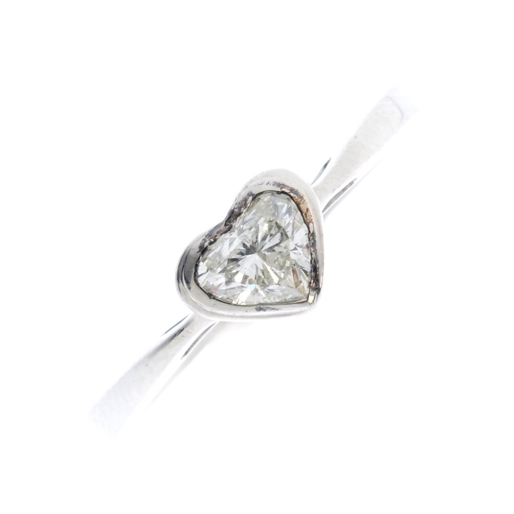 A palladium diamond single-stone ring. The heart-shape (1 of 3)