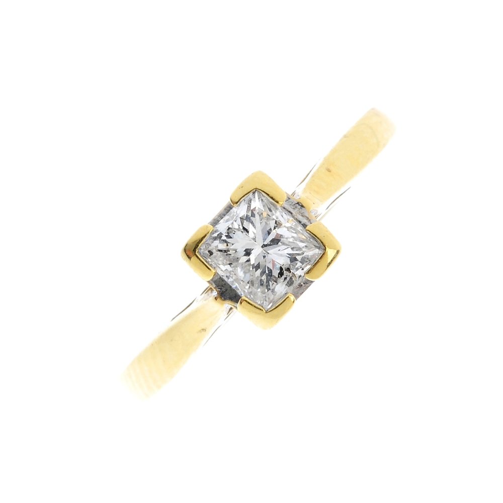 An 18ct gold diamond single-stone ring. The (1 of 3)