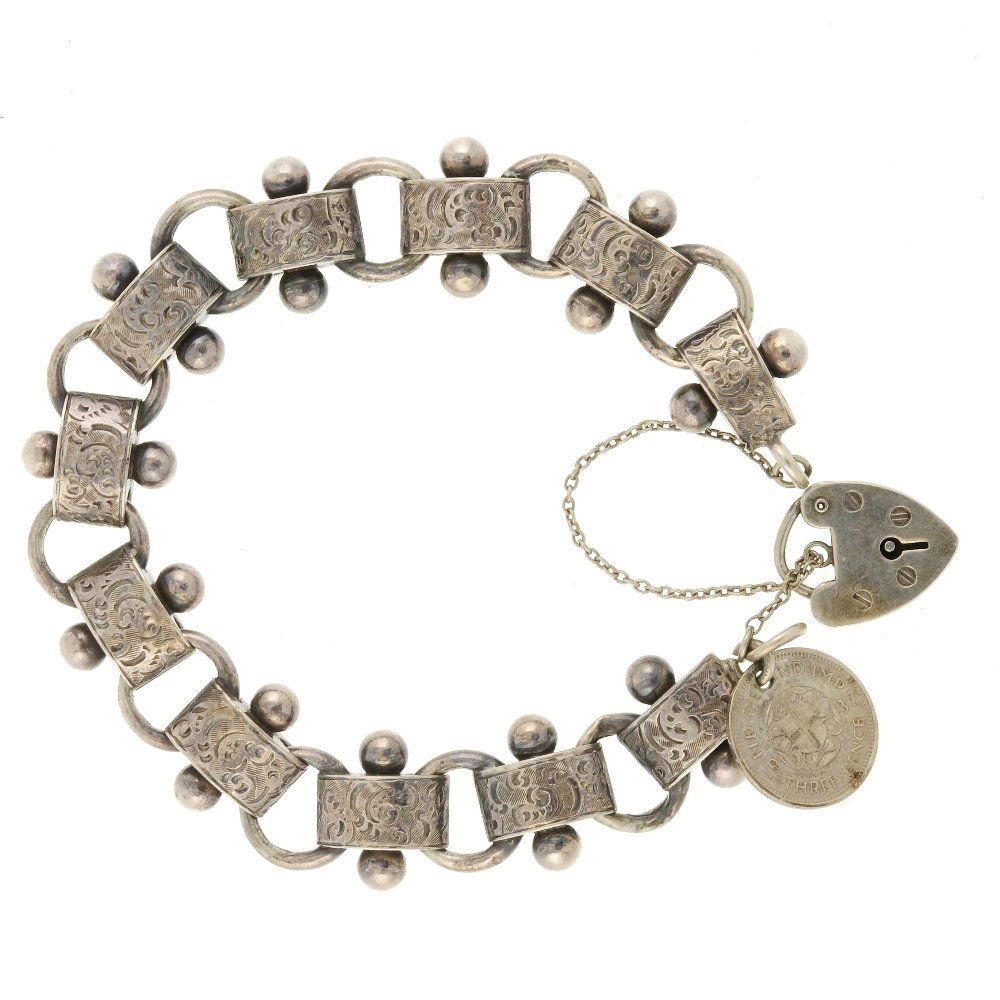 A late Victorian silver bracelet. Each link designed as (1 of 2)