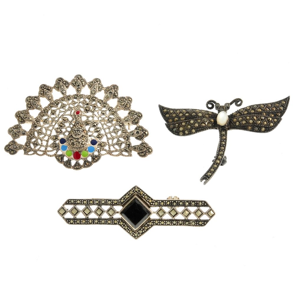 A selection of marcasite jewellery. To include a brooch: A selection of marcasite jewellery. To include a brooch of dragonfly shape with a shell cabochon set to its back and marcasite to its body and wings. Weight 244.3gms.