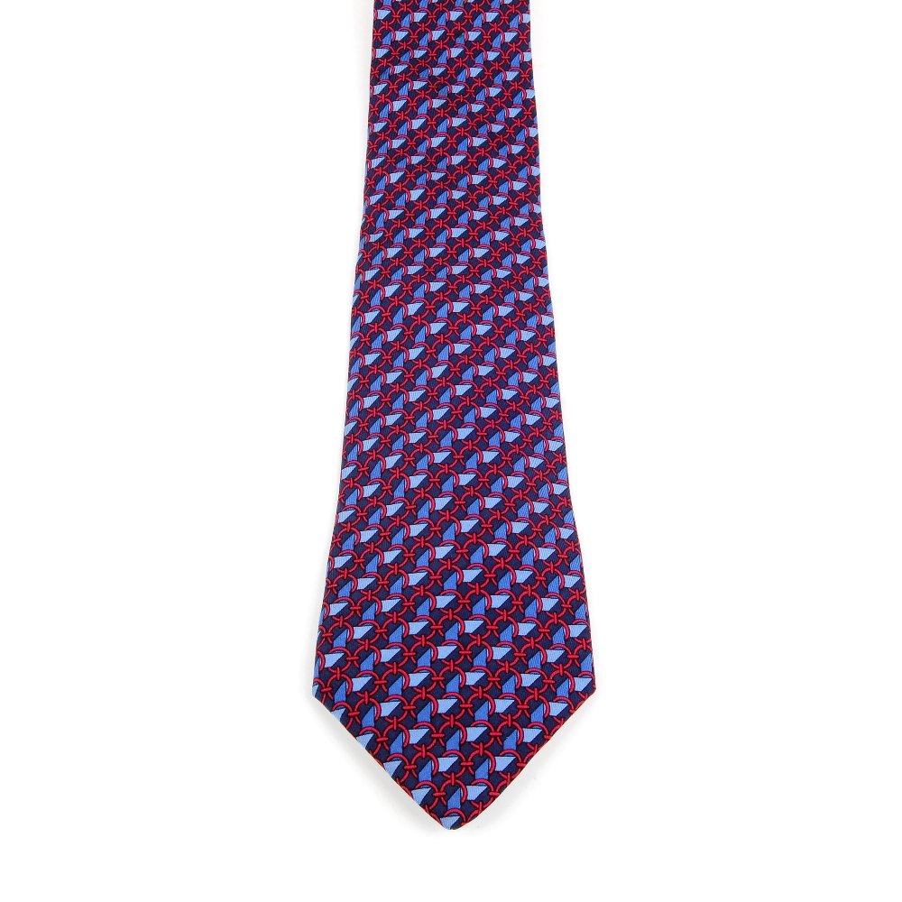HERMÈS - a silk tie. Featuring a red and blue (1 of 3)
