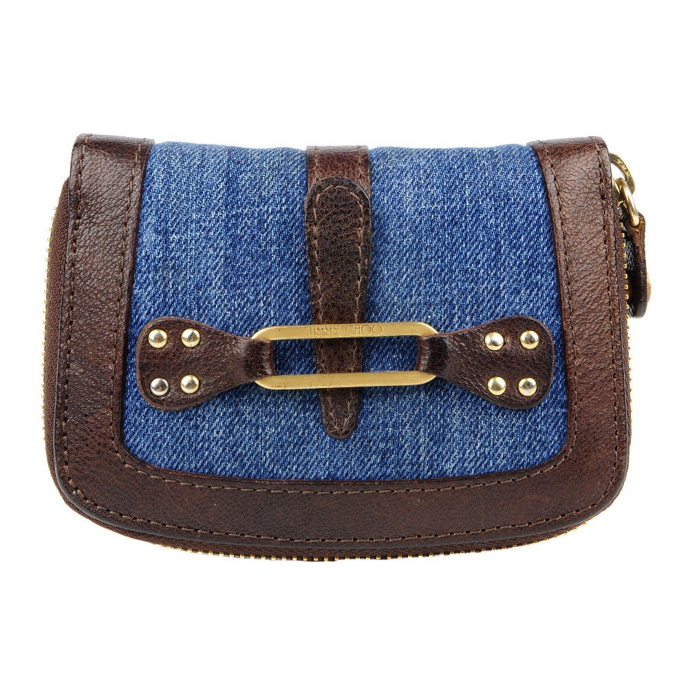 JIMMY CHOO - a denim purse. Featuring a padded denim: JIMMY CHOO - a denim purse. Featuring a padded denim exterior trimmed and lined with brown leather with brushed gold-tone buckle detail. Measuring 3 by 9 by 12cms. With unassociated dust bag.