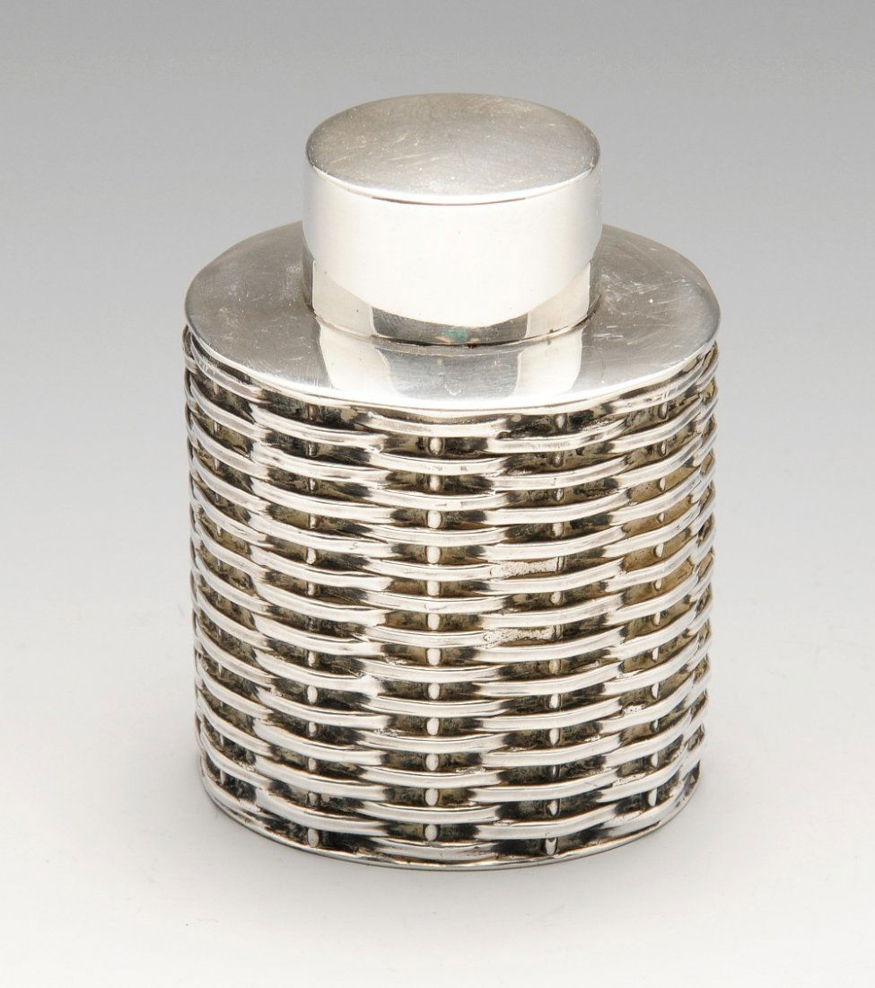 A late Victorian silver caddy of oval basket weave (1 of 7)