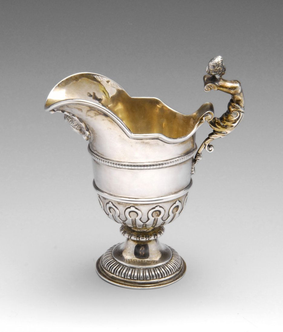 An early twentieth century silver cream jug, the (1 of 5)