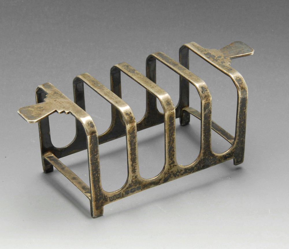 An Art Deco silver four-divide toast rack, the oblong (1 of 3)
