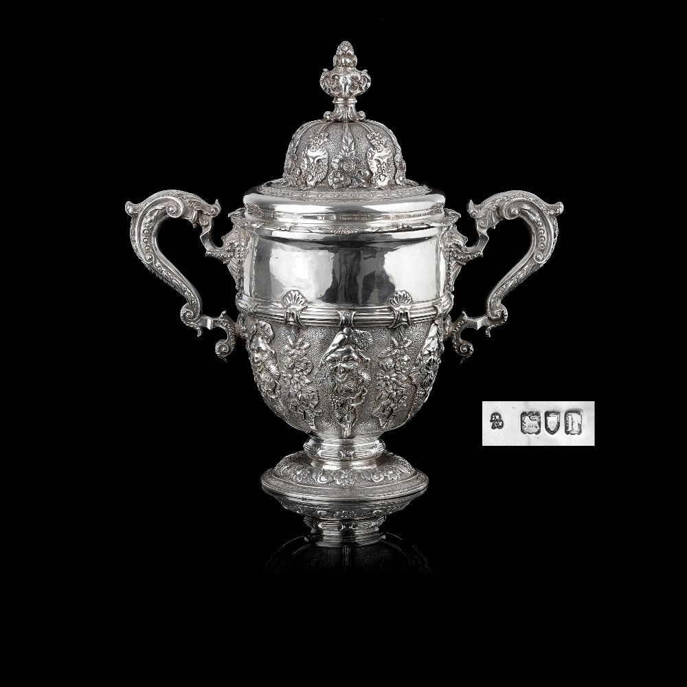 An Edwardian silver twin-handled cup and cover of (1 of 8)