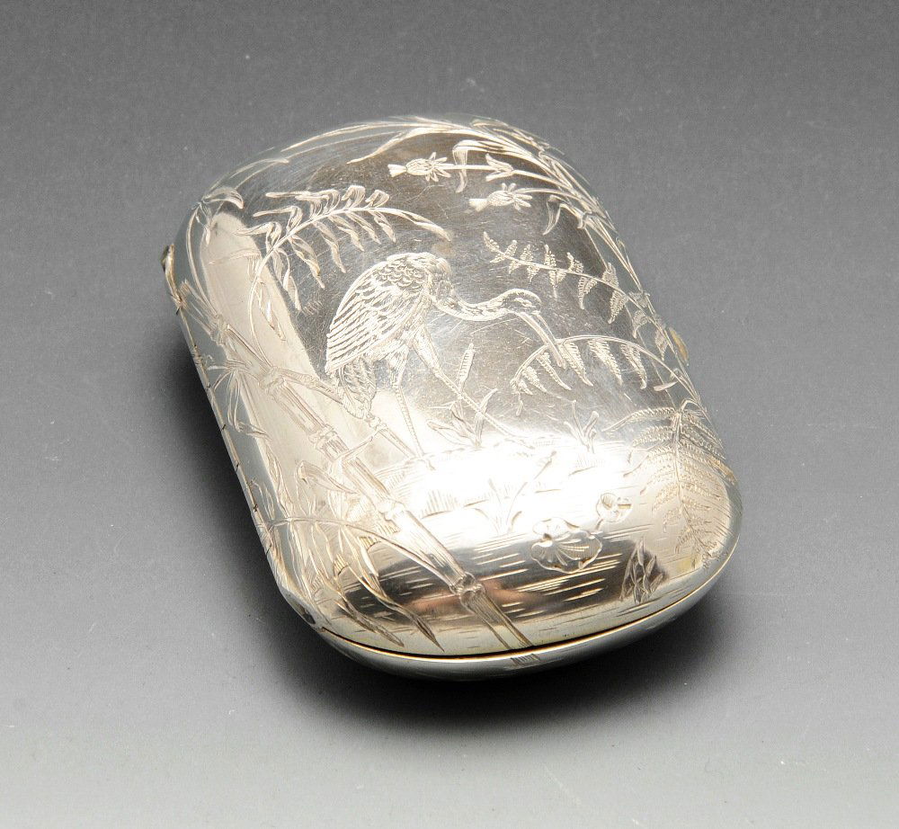 A silver plated cigarette case, the oval form decorated (1 of 5)