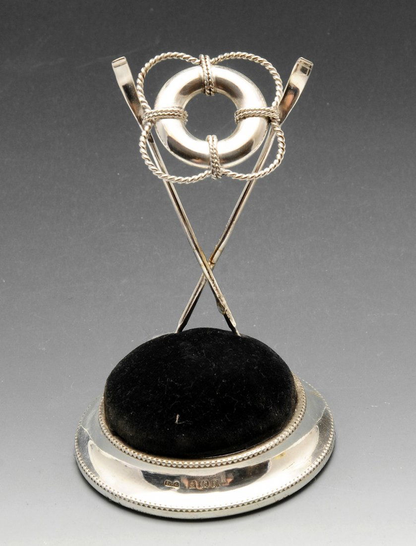 An Edwardian silver mounted pin cushion, the circular (1 of 3)