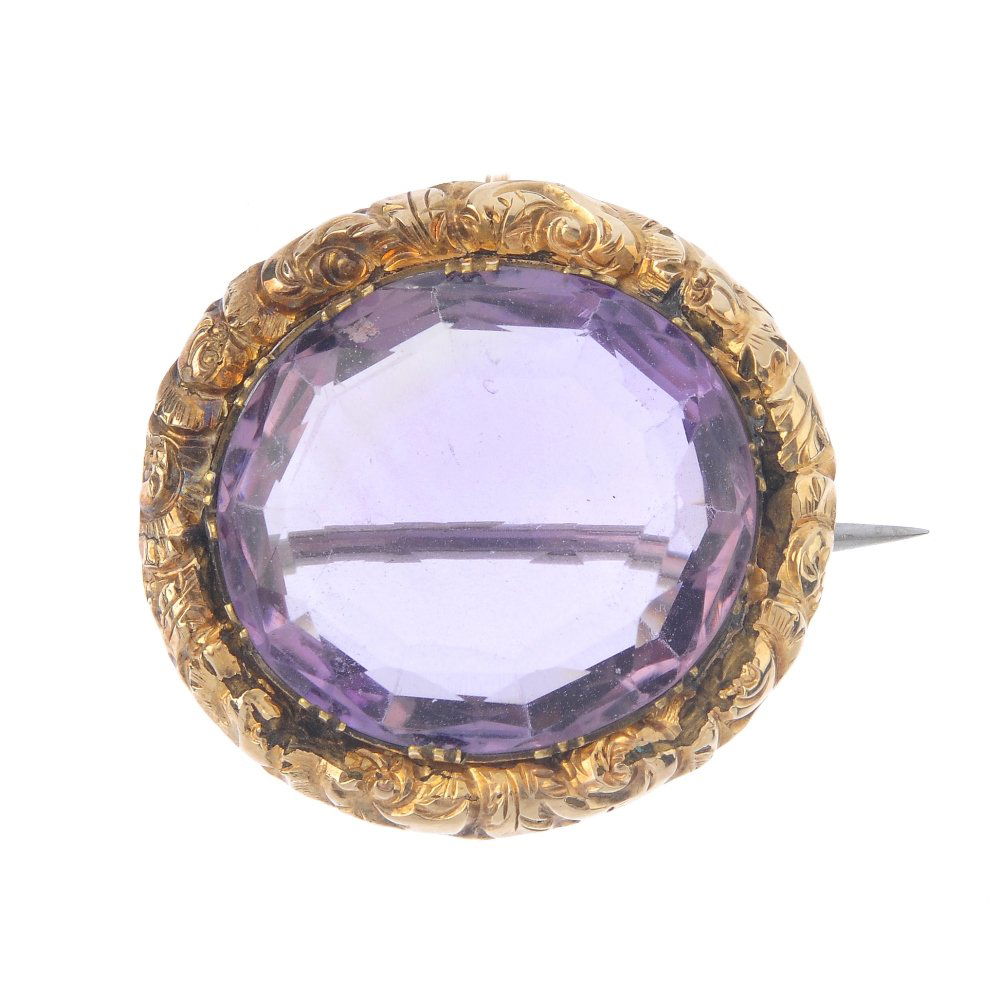 A late Victorian gold amethyst brooch. The oval-shape (1 of 2)