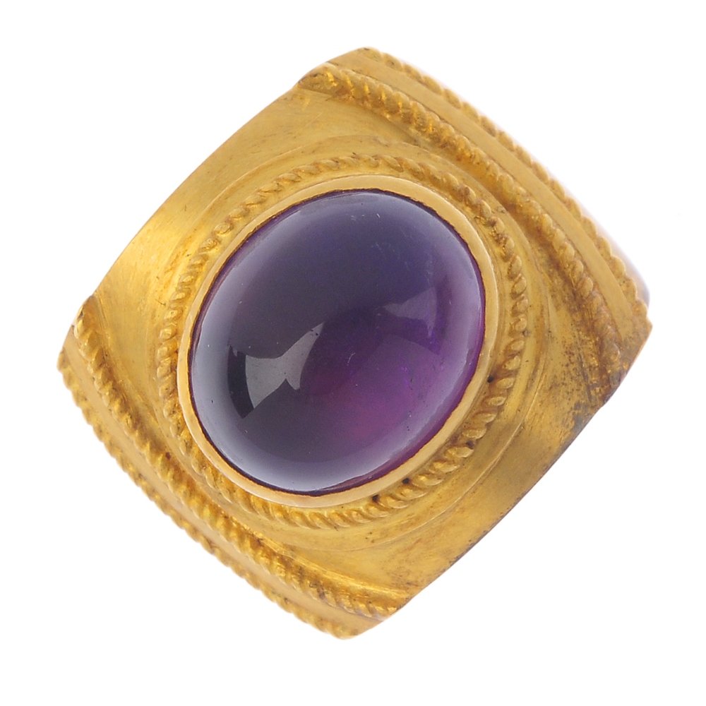 An amethyst single-stone ring. The oval amethyst (1 of 3)