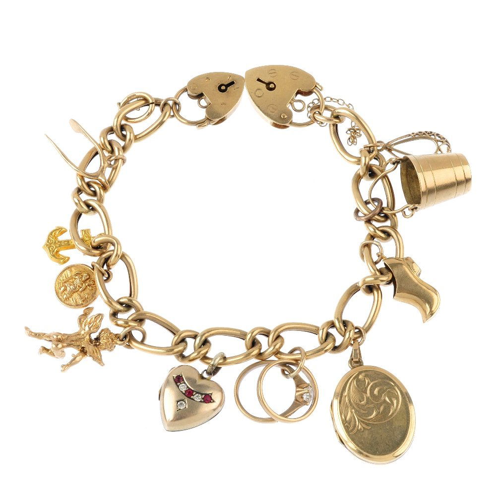 A charm bracelet, with two 9ct gold padlock clasps. The (1 of 2)