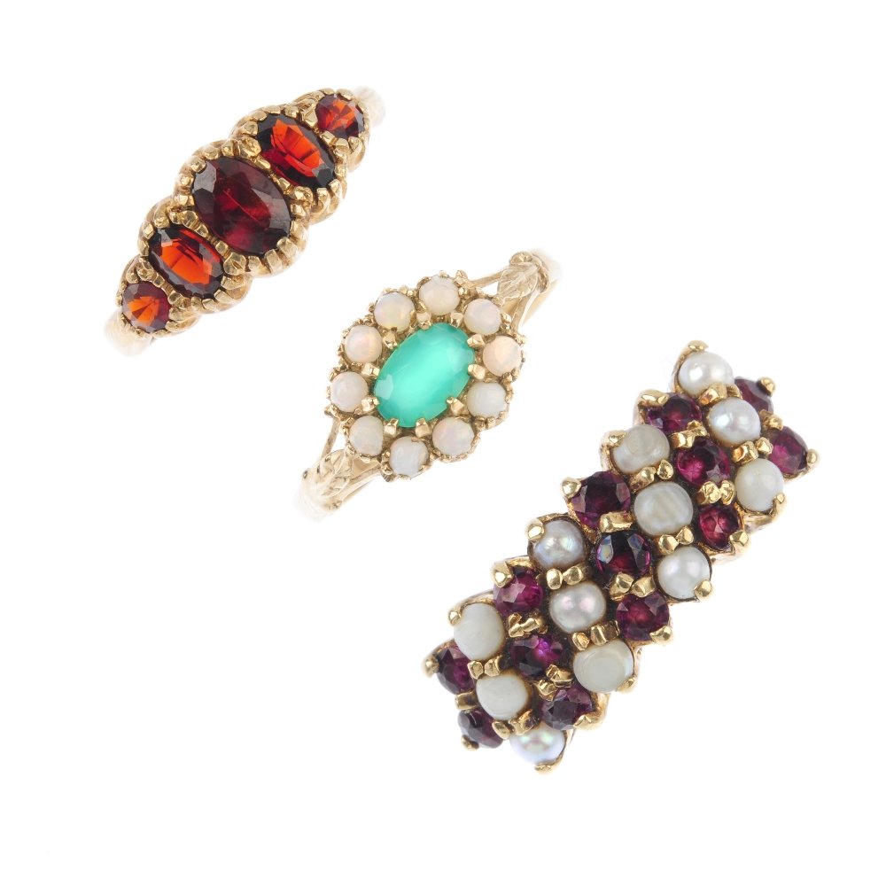 Four 9ct gold gem-set rings. To include a green gem and (1 of 3)