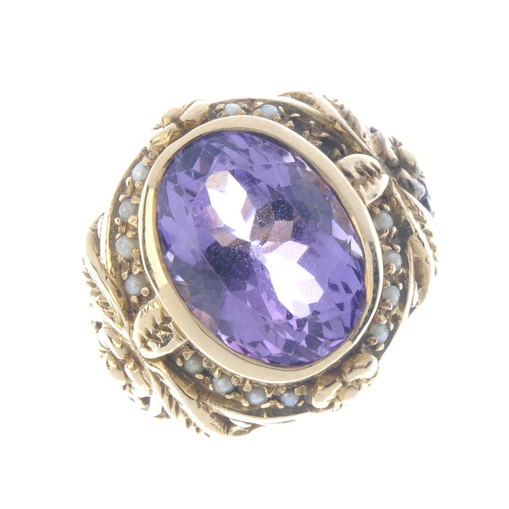 A 9ct gold amethyst and seed pearl ring. The oval-shape (1 of 3)