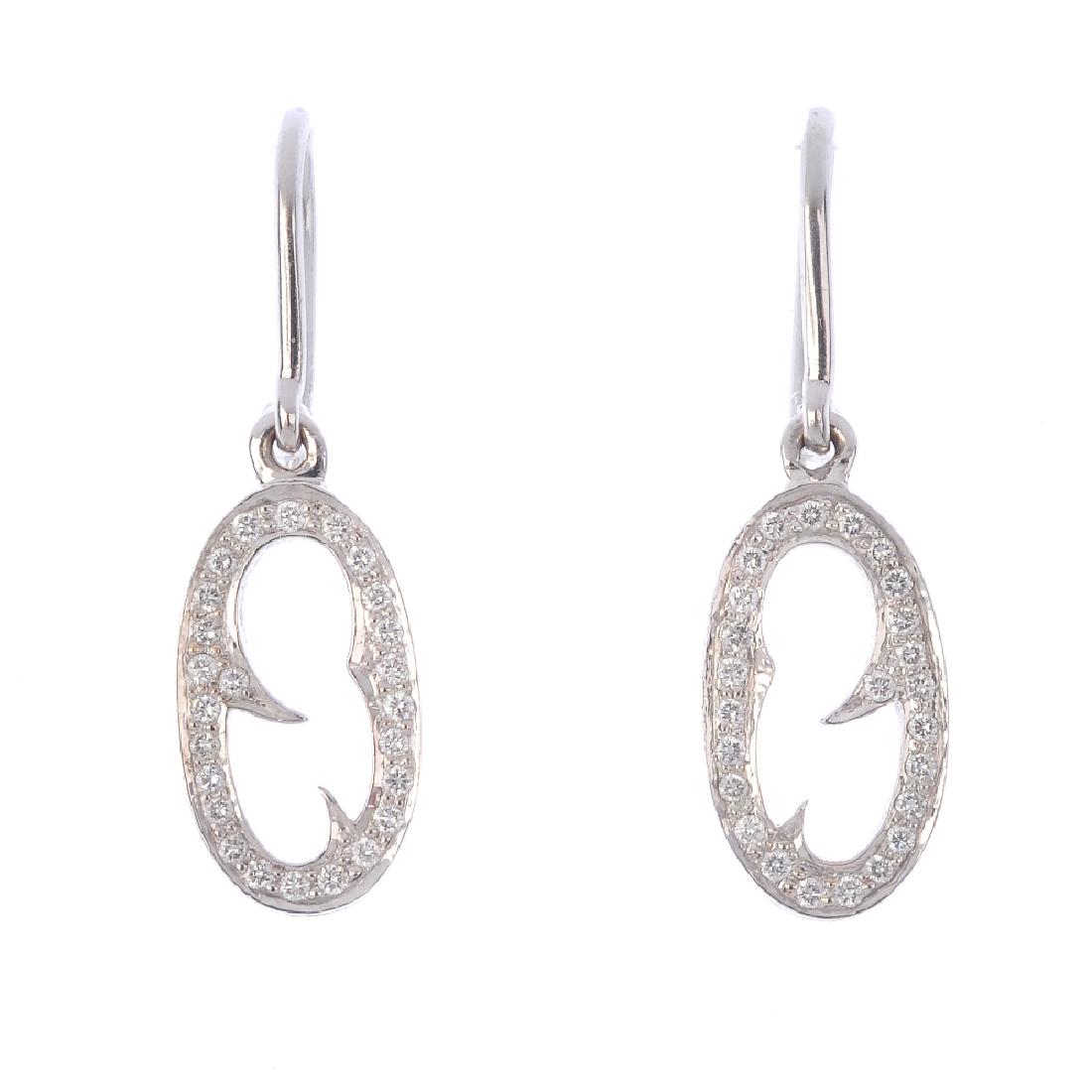 STEPHEN WEBSTER - a pair of diamond 'Thorn' earrings.: STEPHEN WEBSTER - a pair of diamond 'Thorn' earrings. Each designed as a brilliant-cut diamond abstract loop, with thorn highlights, suspended from a hook fitting. Maker's marks for Stephen Webster. E