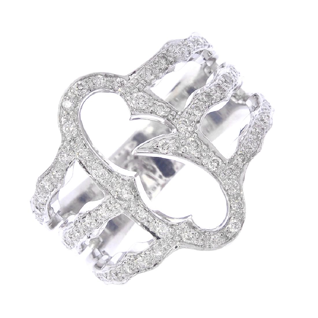 STEPHEN WEBSTER - a diamond 'Thorn' ring. The: STEPHEN WEBSTER - a diamond 'Thorn' ring. The brilliant-cut diamond thorny loop, with similarly-cut diamond triple bar sides. Maker's marks for Stephen Webster. Estimated total diamond weight 0.25ct.