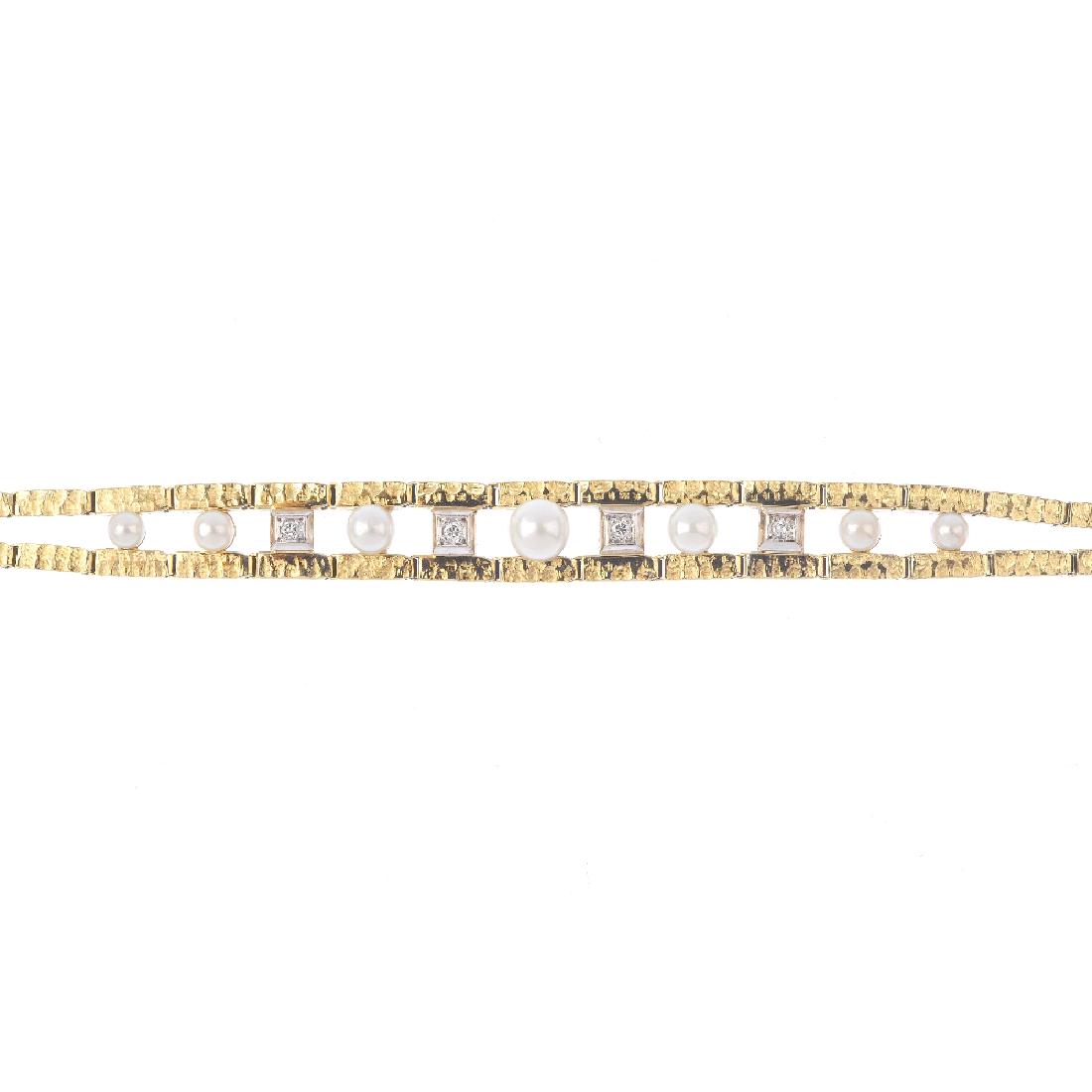A 14ct gold seed pearl and diamond bracelet. Designed (1 of 5)