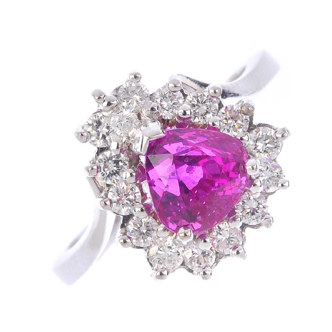 An 18ct gold ruby and diamond cluster ring. The (1 of 6)