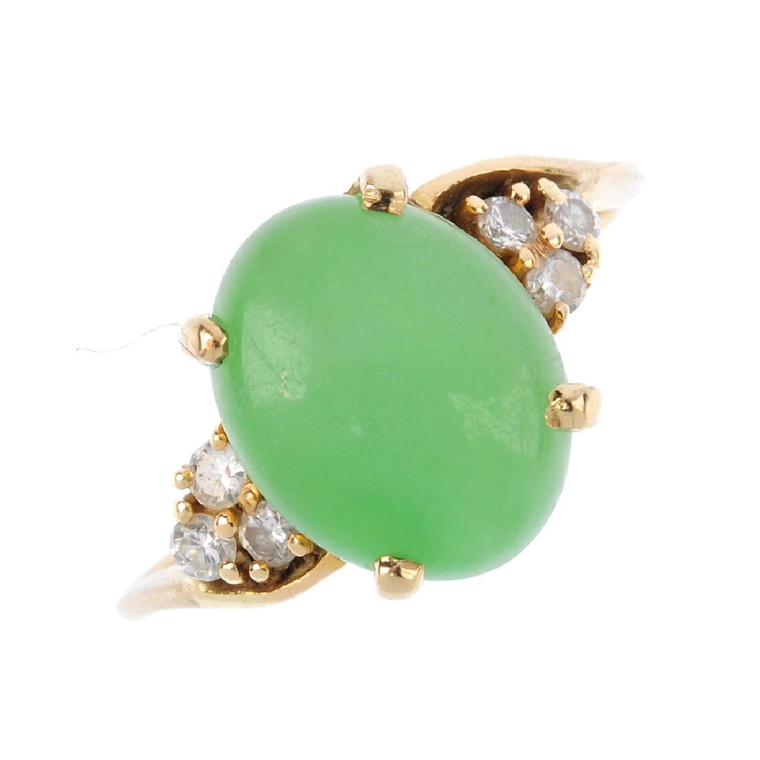 A jade and diamond dress ring. The oval jade cabochon, (1 of 3)
