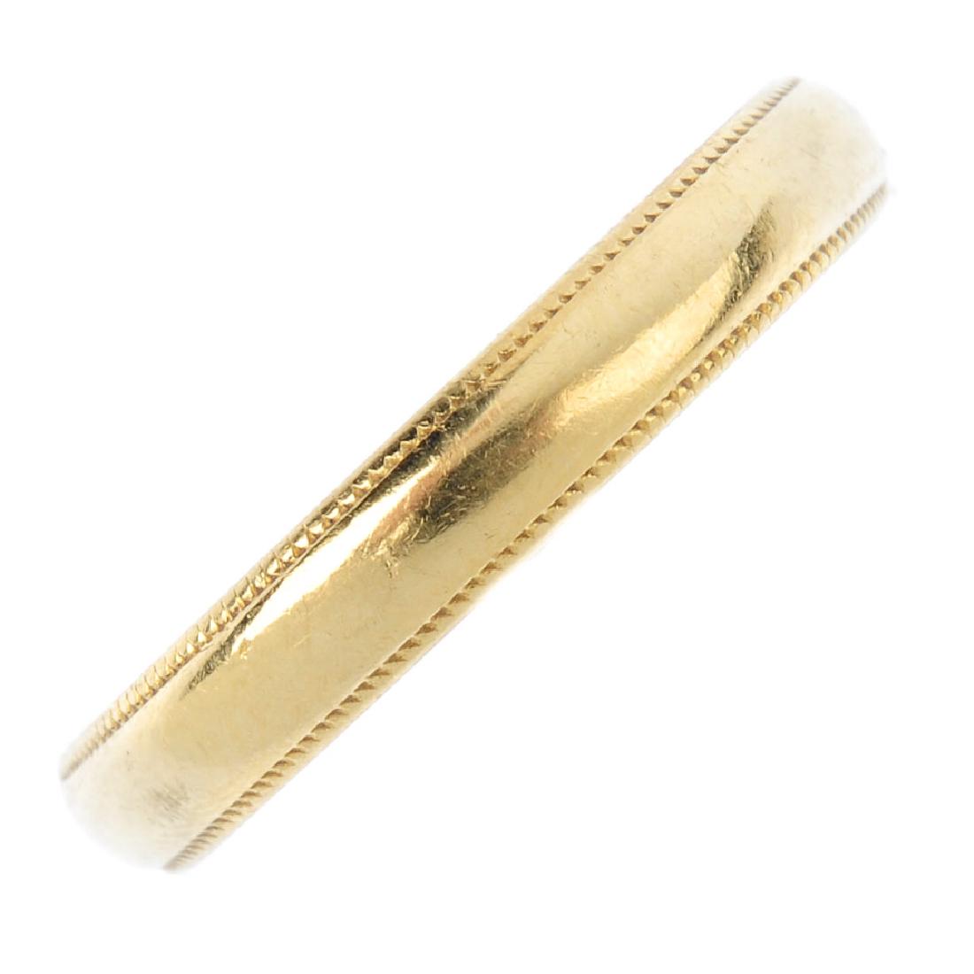 An 18ct gold band ring. Maker's marks for Charles Green (1 of 2)