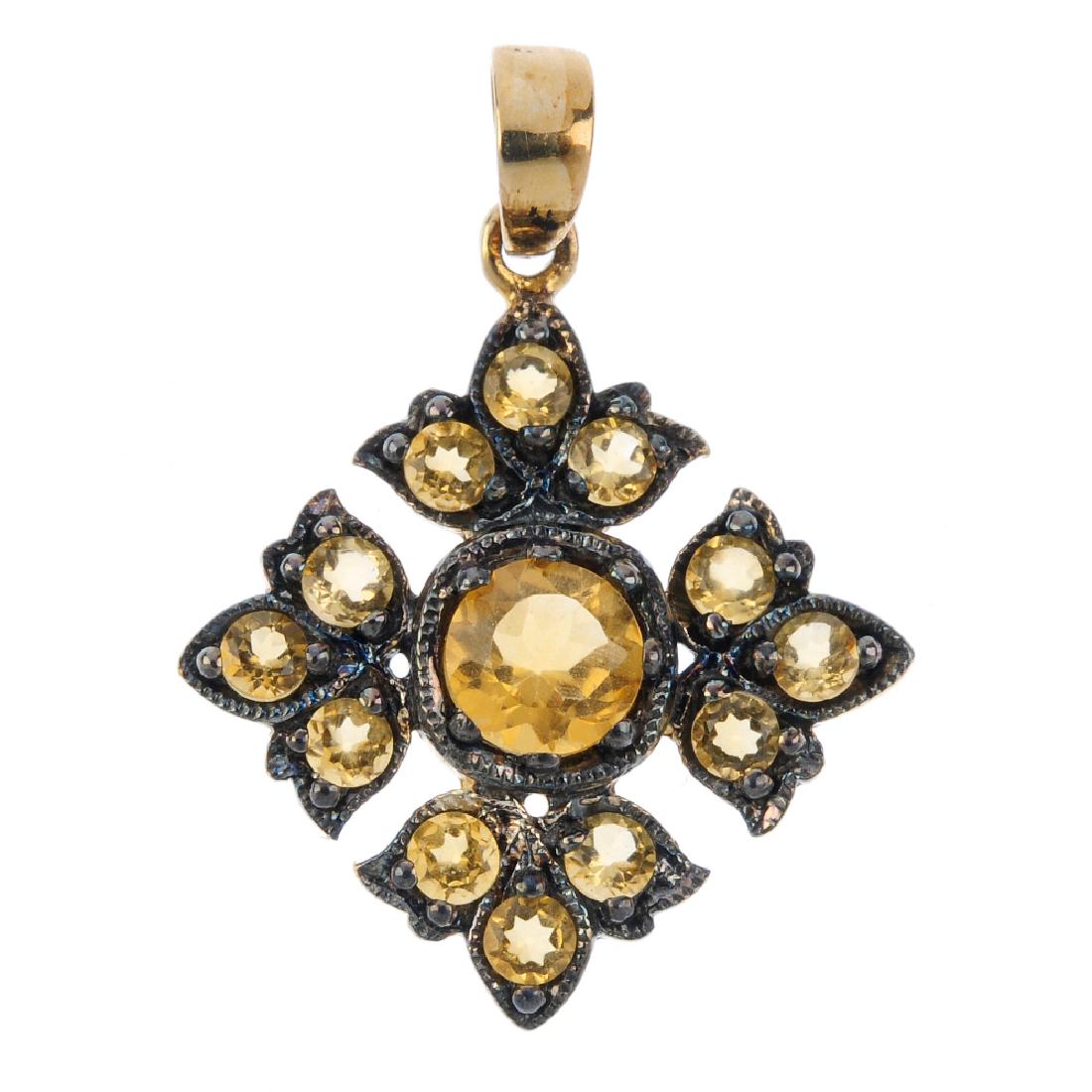 A citrine pendant. The circular-shape citrine, within a (1 of 2)