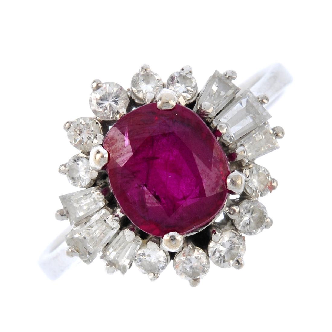 A ruby and diamond cluster ring. The oval-shape ruby, (1 of 3)