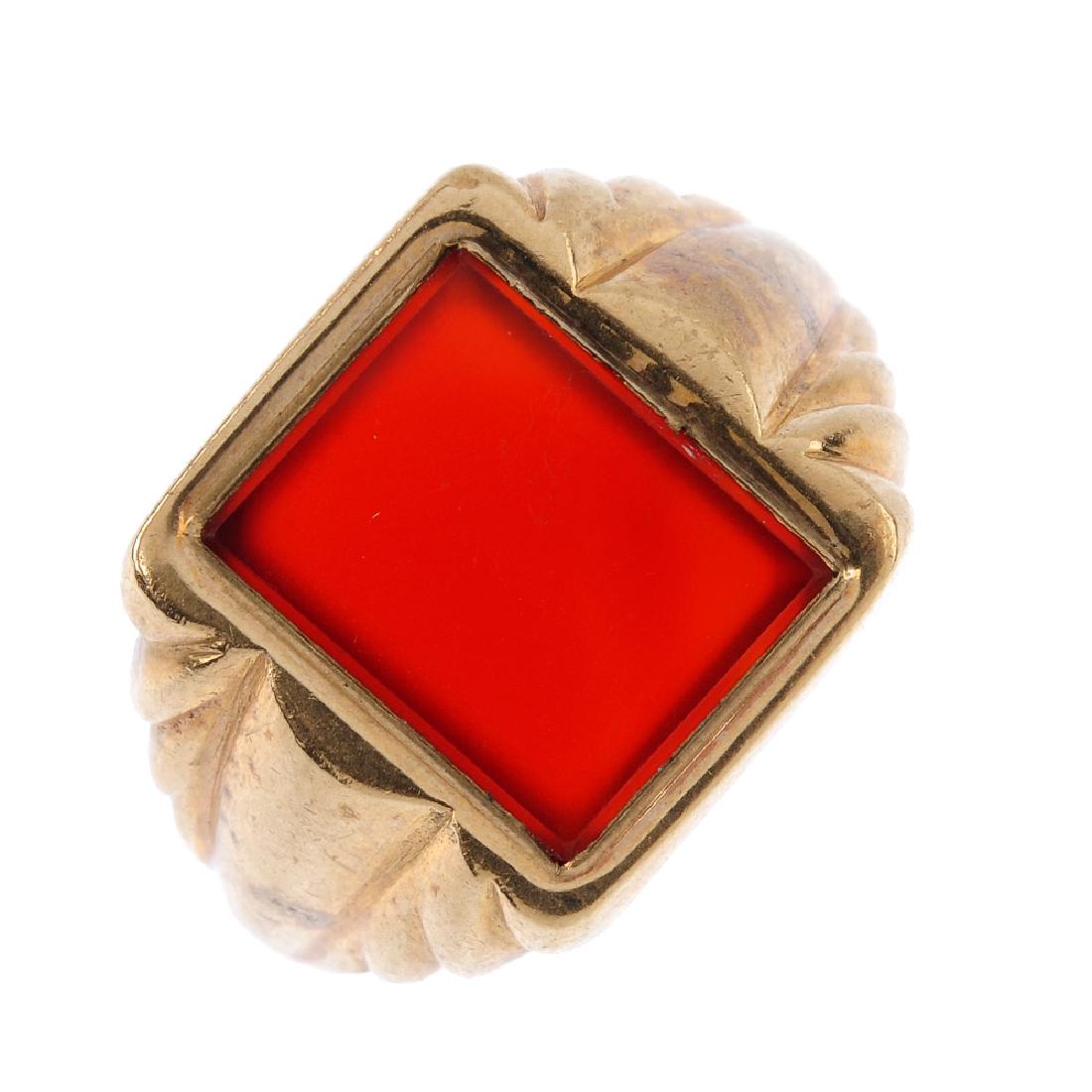 A gentleman's 9ct gold signet ring. The (1 of 3)