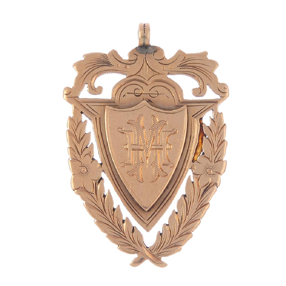 A late Victorian 9ct gold sporting medallion. The (1 of 2)