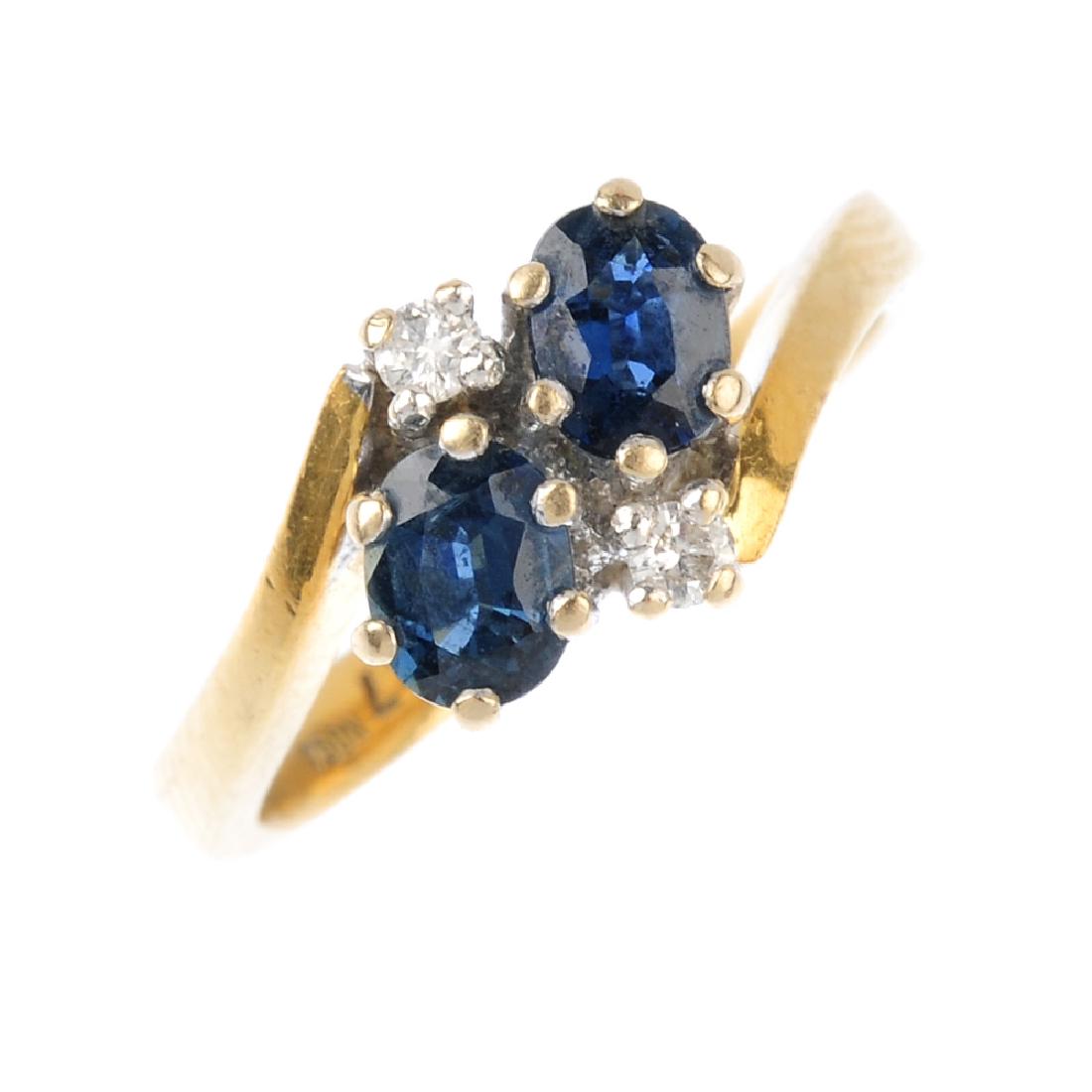 An 18ct gold sapphire and diamond dress ring. The (1 of 3)