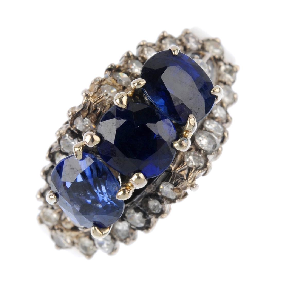A sapphire and diamond dress ring. The oval-shape (1 of 3)