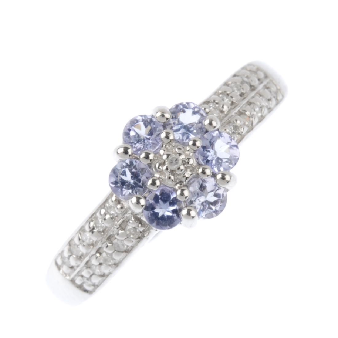 A 9ct gold tanzanite and diamond cluster ring. The (1 of 3)