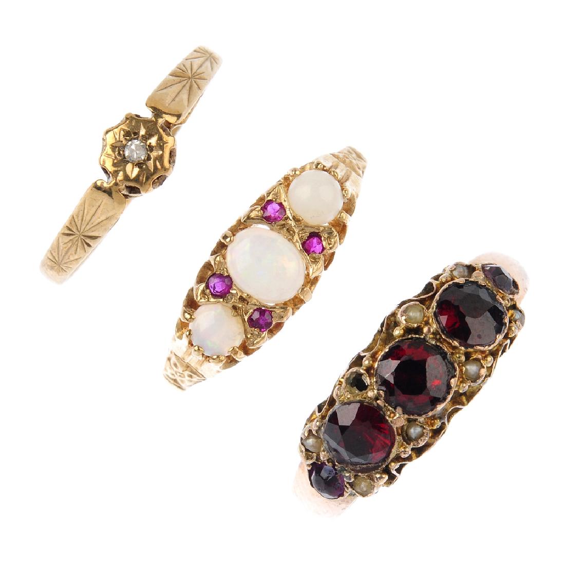 Four gem-set rings. To include a 9ct gold opal and ruby (1 of 3)
