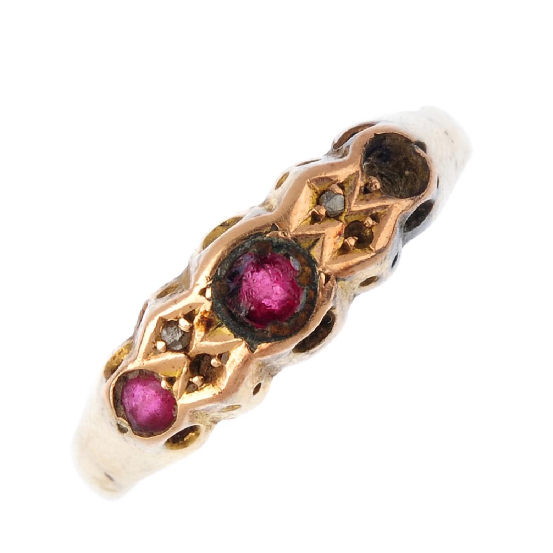 An Edwardian 18ct gold three-stone ring. The red gem (1 of 3)